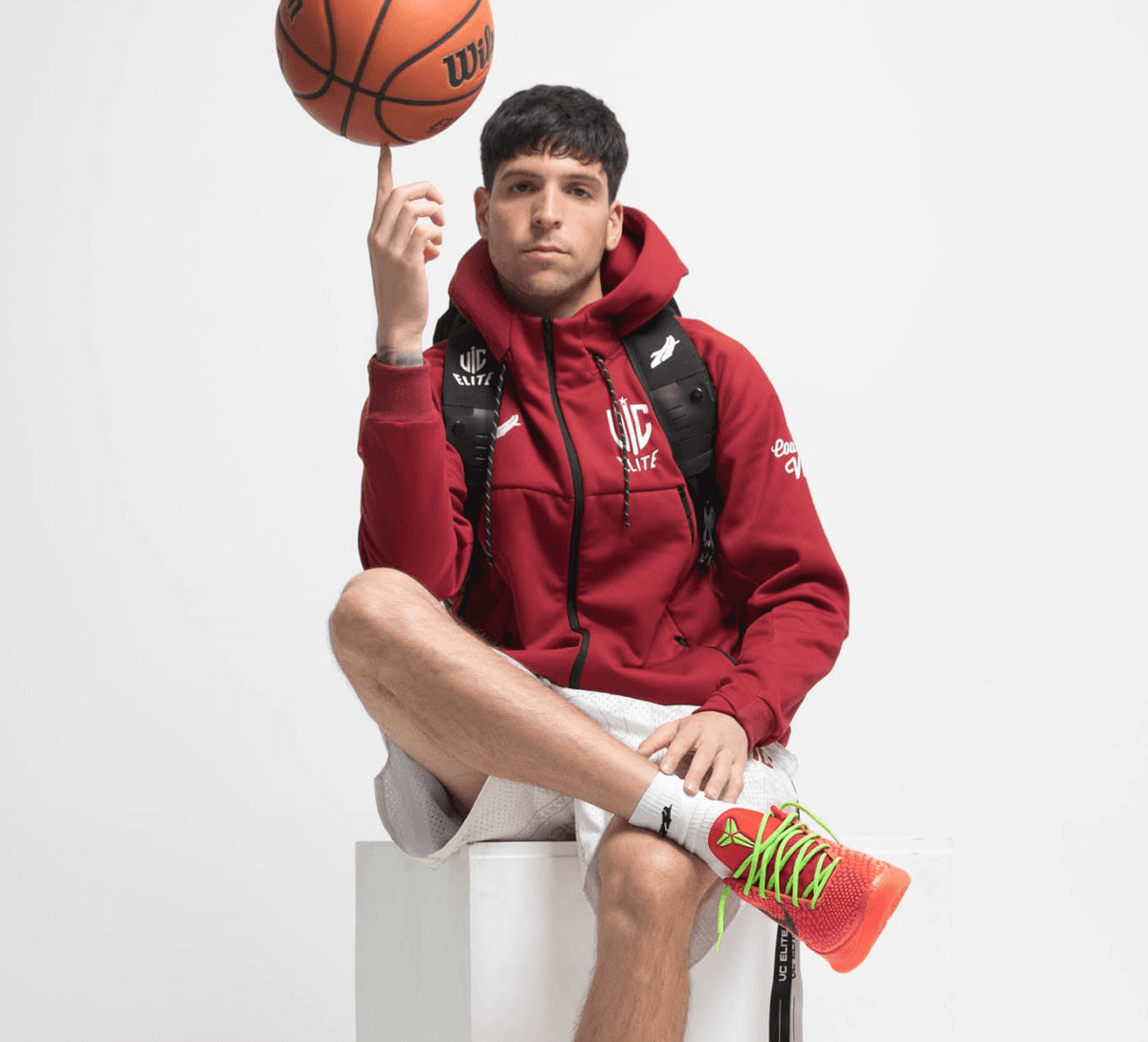 Coach spinning a basketball on his finger