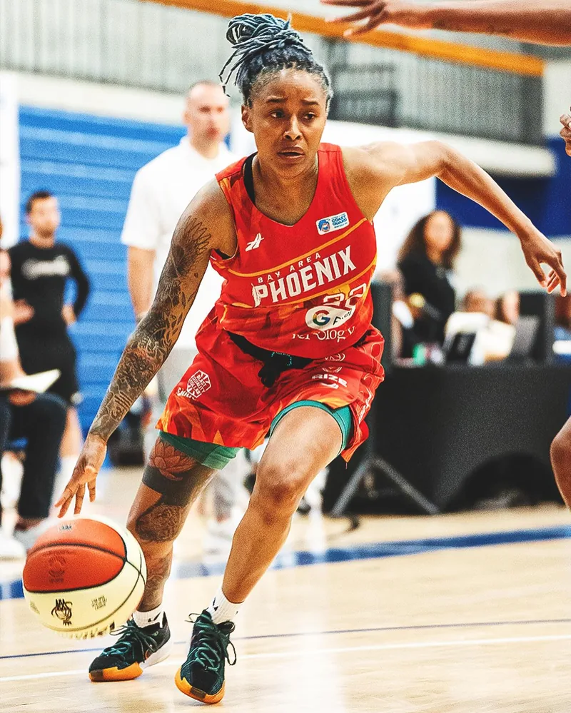 Bay Area Phoenix guard driving in the red flame uniform